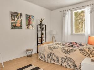 Postel nebo postele na pokoji v ubytování Holiday Home Huvikumpu by Interhome