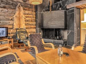a living room with a bear statue on the wall at Holiday Home Poromooli a1 by Interhome in Saariselka
