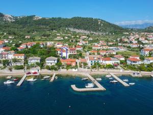 an aerial view of a town with boats in the water at Holiday Home Domy by Interhome in Rab