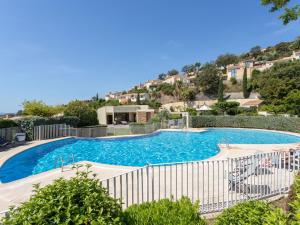 a swimming pool with a fence around it at Holiday Home Le Belvédère by Interhome in La Londe-les-Maures