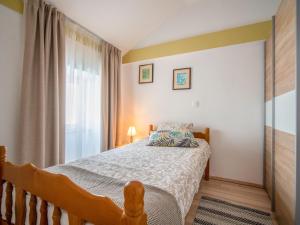 Łóżko lub łóżka w pokoju w obiekcie Holiday Home Veli by Interhome
