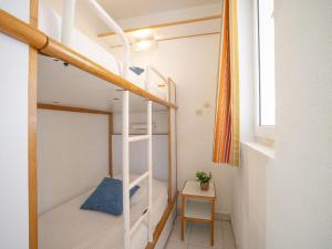 Posteľ alebo postele v izbe v ubytovaní Studio Le Belvédère - R3 221 by Interhome
