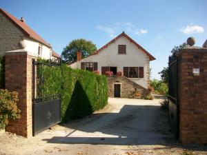 a house with a gate in front of it at Holiday home Gîte des Hautes Côtes de Beaune in Magny-lès-Villers