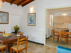 a kitchen and dining room with a table and chairs at Holiday Home Ca'Mea by Interhome in Chiusanico +18 photos