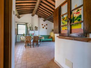 a kitchen and living room with a table and chairs at Apartment Tramontana by Interhome in Bibbona +48 photos