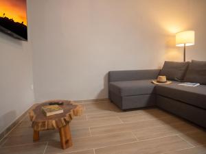 a living room with a couch and a coffee table at Villa Riviera by Interhome in Sintra