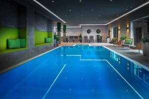 a swimming pool with a blue floor and blue walls at ever grün KAPRUN - NEW OPENING in Kaprun
