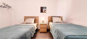 Posteľ alebo postele v izbe v ubytovaní Apartamento MURILLO-PLAZA DE LA MAGDALENA