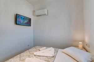 Postel nebo postele na pokoji v ubytování Sand house Antiparos