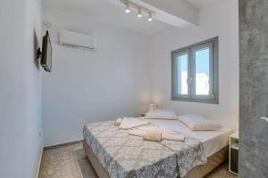 Postel nebo postele na pokoji v ubytování Sand house Antiparos