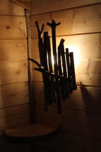 a group of wooden crosses hanging from a wall at Acabatz de dintrar in Brezons