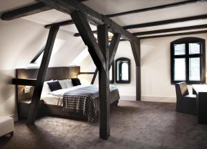 a bedroom with a bed in a attic at Hotel Pałac Jugowice in Jugowice +125 photos