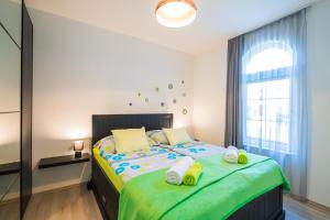 Posteľ alebo postele v izbe v ubytovaní Phoenix Apartman Siófok