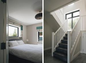 a bedroom with a bed and a stairway at Lamb Cottage in Ballycastle