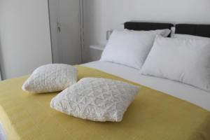 two pillows sitting on top of a bed at Apartment River in Klis