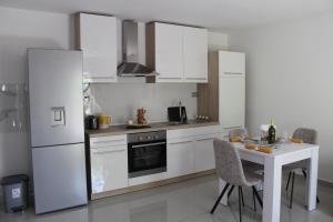 Kuchyň nebo kuchyňský kout v ubytování Apartment River + 11 fotografií