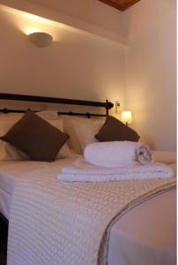 Ένα ή περισσότερα κρεβάτια σε δωμάτιο στο Corali Luxury Beach Apartment