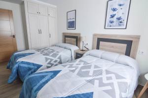 Posteľ alebo postele v izbe v ubytovaní Apartamentos Turísticos Hornillo AT-CC-00681