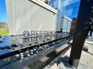 a reflection of a building with pigeons on the facade at Umhlanga Arch Luxury in Durban