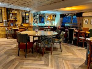 a dining room with a table and chairs at The Beeches, Ashby-de-la-Zouch in Ashby de la Zouch