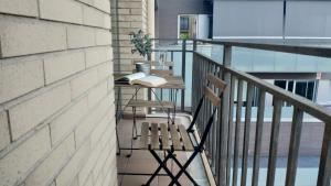 a balcony with a table and a book on it at Illa, 4 in Girona