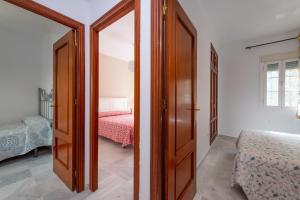 Posteľ alebo postele v izbe v ubytovaní Casa Melqart