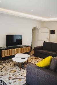 a living room with a couch and a coffee table at Casa do Avô Horácio in Carreço