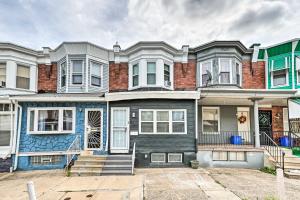 a row of houses in front of a street at Cozy Philadelphia Retreat about 4 Mi to Downtown in Philadelphia