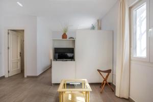 Televízia a/alebo spoločenská miestnosť v ubytovaní Casa de 10 - 4 Interior
