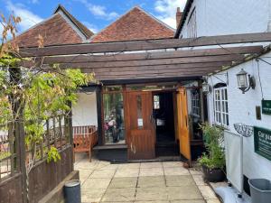 an entrance to a house with a wooden door at The Swan Inn in East Ilsley