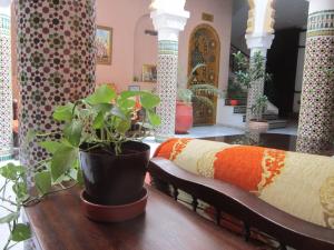 Ένα ή περισσότερα κρεβάτια σε δωμάτιο στο Riad Dar Alia