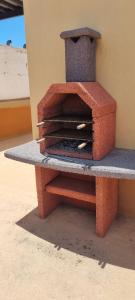 a brick oven sitting on top of a table at El Cotillo Tranquilidad,NearSea,Stylish,Well equipped in El Cotillo