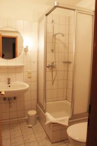 a bathroom with a shower and a sink at Haus Strandgang, Whg 9 in Kellenhusen