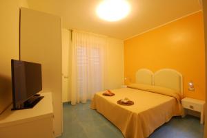 Postel nebo postele na pokoji v ubytování Residence Abruzzo Resort