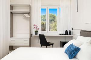 Posteľ alebo postele v izbe v ubytovaní Nelli Rooms Via Veneto