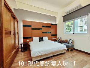 Postel nebo postele na pokoji v ubytování 小雅民宿 Oo自助入住旅店oO