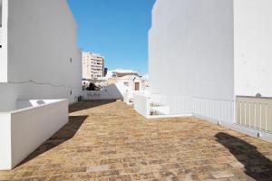 a view from the balcony of a white building at Casa Vermelha ii in Faro