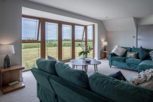 O zonă de relaxare la Knights Rest - 4 Bed Holiday Home - Princes Gate