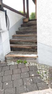 a set of stairs leading up to a house at Apartment mit Gartenblick in Forchheim