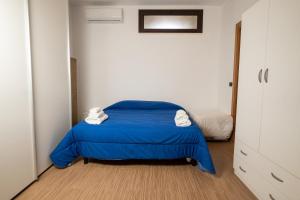 Un pat sau paturi într-o cameră la La Dimora degli Artisti