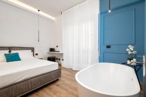 Posteľ alebo postele v izbe v ubytovaní Nelli Rooms Via Veneto