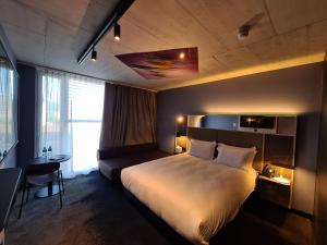 Mercure Hotel Delémont客房内的一张或多张床位