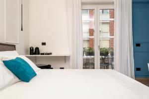 Posteľ alebo postele v izbe v ubytovaní Nelli Rooms Via Veneto