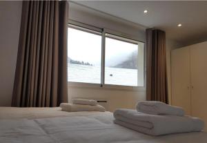 En eller flere senge i et værelse på Lac et Montagne