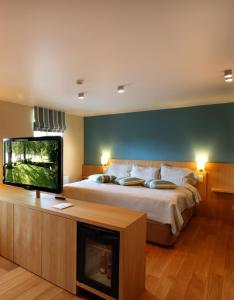 Postel nebo postele na pokoji v ubytování Hotel des Bains & Wellness