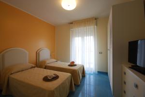 TV a/nebo společenská místnost v ubytování Residence Abruzzo Resort
