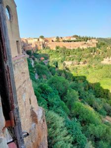 a view of a field from a building at vista sulla vallata in Pitigliano