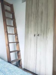 Postel nebo postele na pokoji v ubytování Apartament nad Jeziorem Długim