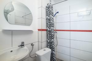a bathroom with a sink and a toilet and a mirror at Chyba Wyspa, Ostrowo in Ostrowo