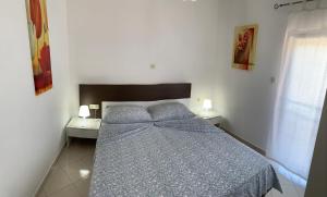 Posteľ alebo postele v izbe v ubytovaní Apartments Mais Tisno